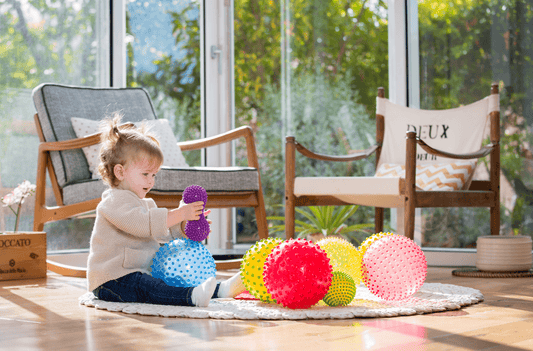 Baby Playing with Sensory Ball. Calming Sensory Play